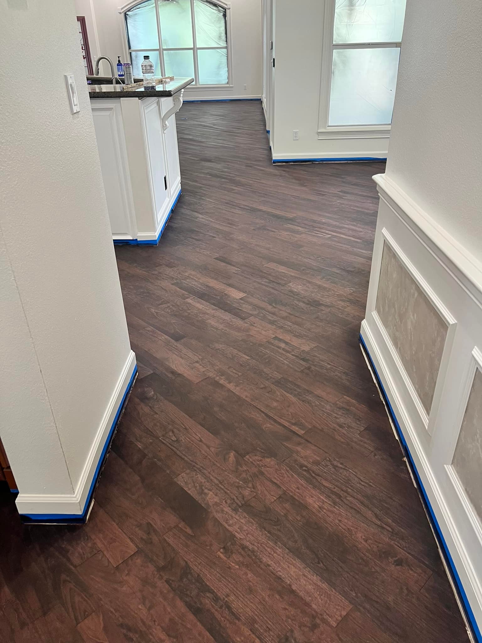 Luxury vinyl plank flooring installation in a kitchen